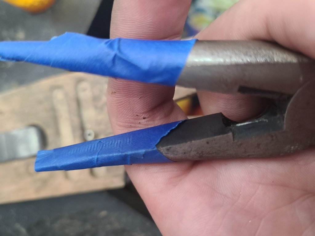 tape on pliers to protect from scratching