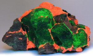 Willemite glows green under short wave ultraviolet light best UV black light flashlight for minerals